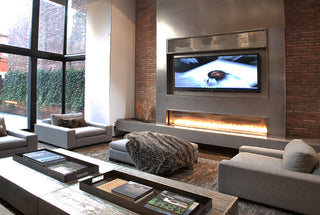 Feature wall in a living room with concrete wall panels and brick.